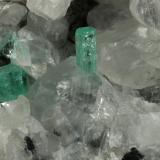 Beryl (variety emerald), Calcite<br />La Pita mining district, Municipio Maripí, Western Emerald Belt, Boyacá Department, Colombia<br />49x44x36mm, xls=6 & 4mm<br /> (Author: Fiebre Verde)