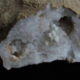 Malachite on Calcite on Quartz<br />Monroe County, Indiana, USA<br />calcites are 3 mm,  malachites are 1 mm<br /> (Author: Bob Harman)