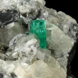 Beryl (variety emerald), Calcite, PyriteMuzo (distrito minero), Cinturón Esmeraldífero Occidental, Departamento Boyacá, Colombia65x90x85mm, aggregate=14x9mm (Author: Fiebre Verde)