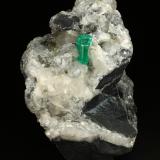 Beryl (variety emerald), Calcite, Pyrite<br />Muzo mining district, Western Emerald Belt, Boyacá Department, Colombia<br />65x90x85mm, aggregate=14x9mm<br /> (Author: Fiebre Verde)