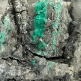 Beryl (variety emerald), Calcite, Dolomite<br />La Pita mining district, Municipio Maripí, Western Emerald Belt, Boyacá Department, Colombia<br />120x83x68mm, main xl=14mm<br /> (Author: Fiebre Verde)