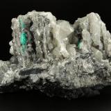 Beryl (variety emerald), Calcite, Dolomite<br />La Pita mining district, Municipio Maripí, Western Emerald Belt, Boyacá Department, Colombia<br />120x83x68mm, main xl=14mm<br /> (Author: Fiebre Verde)