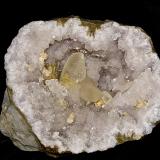 Barite and Calcite on Quartz and with Dolomite<br />Monroe Reservoir spillway, Monroe County, Indiana, USA<br />geode cavity is 15 x 13 cm largest calcite is about 5 cm and the barites are about 2.5 cm<br /> (Author: Bob Harman)