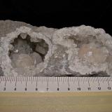 Calcite on QuartzSheffler's Rock Shop and Geode Mine, Alexandria, Clark County, Missouri, USAthe 2 chambered geode is  12 cm. each cavity is about 4 cm (Author: Bob Harman)