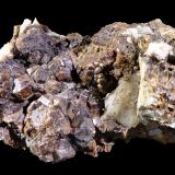 Granate (Grupo)<br />Mina Roca del Turó, Costabona, Espinavell (Espinabell), Molló, Comarca Ripollès, Gerona / Girona, Cataluña / Catalunya, España<br />7 x 3 x 4 cm<br /> (Autor: Mineratlas)