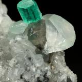 Beryl (variety emerald), Calcite, Dolomite<br />La Pita mining district, Municipio Maripí, Western Emerald Belt, Boyacá Department, Colombia<br />32x28x22mm, xl=11mm<br /> (Author: Fiebre Verde)