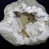 Barite and Calcite on QuartzState Route 37 road cuts, Harrodsburg, Clear Creek Township, Monroe County, Indiana, USAgeode is 21 cm    calcite is 8 cm     barite is 4.7 cm (Author: Bob Harman)