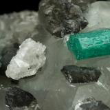 Beryl (variety emerald), Calcite, Dolomite<br />La Pita mining district, Cunas Mine, Municipio Maripí, Western Emerald Belt, Boyacá Department, Colombia<br />61x50x38mm, xls=22 & 17mm<br /> (Author: Fiebre Verde)