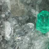 Beryl (variety emerald), Calcite, Quartz<br />Muzo mining district, Western Emerald Belt, Boyacá Department, Colombia<br />43x68x27mm, largest xl=8mm<br /> (Author: Fiebre Verde)