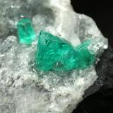 Beryl (variety emerald), Calcite, Quartz<br />Muzo mining district, Western Emerald Belt, Boyacá Department, Colombia<br />43x68x27mm, largest xl=8mm<br /> (Author: Fiebre Verde)