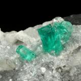 Beryl (variety emerald), Calcite, Quartz<br />Muzo mining district, Western Emerald Belt, Boyacá Department, Colombia<br />43x68x27mm, largest xl=8mm<br /> (Author: Fiebre Verde)