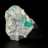 Beryl (variety emerald), Calcite, Quartz<br />Muzo mining district, Western Emerald Belt, Boyacá Department, Colombia<br />43x68x27mm, largest xl=8mm<br /> (Author: Fiebre Verde)