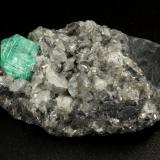 Beryl (variety emerald), Calcite, Dolomite<br />La Pita mining district, Municipio Maripí, Western Emerald Belt, Boyacá Department, Colombia<br />39x24x18mm, xl=9mm<br /> (Author: Fiebre Verde)