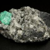 Beryl (variety emerald), Calcite, Dolomite<br />La Pita mining district, Municipio Maripí, Western Emerald Belt, Boyacá Department, Colombia<br />39x24x18mm, xl=9mm<br /> (Author: Fiebre Verde)