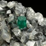 Beryl (variety emerald), Calcite, Dolomite<br />La Pita mining district, Municipio Maripí, Western Emerald Belt, Boyacá Department, Colombia<br />53x38x34mm, xl=5x4mm<br /> (Author: Fiebre Verde)