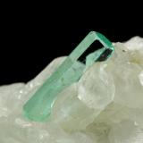 Beryl (variety emerald), Calcite<br />La Pita mining district, Municipio Maripí, Western Emerald Belt, Boyacá Department, Colombia<br />46x85x20mm, xls=26, 16 & 13mm<br /> (Author: Fiebre Verde)