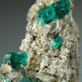 Beryl (variety emerald), Dolomite, Pyrite<br />Chivor mining district, San Gregorio Mine, Municipio Chivor, Eastern Emerald Belt, Boyacá Department, Colombia<br />21x58x31mm, largest xl=13mm<br /> (Author: Fiebre Verde)