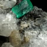 Beryl (variety emerald), Calcite<br />Coscuez mining district, Municipio San Pablo de Borbur, Western Emerald Belt, Boyacá Department, Colombia<br />59x20x60mm, xl=7x5mm<br /> (Author: Fiebre Verde)