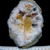 Barite and Dolomite on QuartzState Route 37 road cuts, Harrodsburg, Clear Creek Township, Monroe County, Indiana, USAspecimen is 10 cm, barites are 3 cm and the dolomite groupings are 1 cm (Author: Bob Harman)