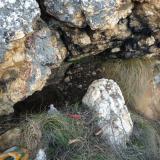 This is the place I spent most of my time.  The crystals that I removed from the soil, appears to have fallen down a large gap behind a rock, from higher up.  It is to dangerous to attempt to remove this rock (Author: Pierre Joubert)