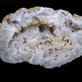Aragonite on Quartz<br />Monroe County, Indiana, USA<br />oval geode is 12cm x 7cm.    The aragonite sprays range from 1.3cm to 3.5cm<br /> (Author: Bob Harman)