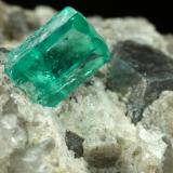 Beryl (variety emerald), Calcite, Dolomite<br />Chivor mining district, Municipio Chivor, Eastern Emerald Belt, Boyacá Department, Colombia<br />22x20x20mm, xl=5mm<br /> (Author: Fiebre Verde)