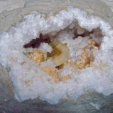 Barite and Dolomite on Quartz<br />State Route 37 road cuts, Harrodsburg, Clear Creek Township, Monroe County, Indiana, USA<br />geode cavity is 13 cm x 10 cm. barite crystal is 5 cm and dolomite groupings are up to 4.5 cm<br /> (Author: Bob Harman)