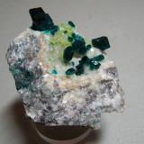 Dioptase on CalciteTsumeb Mine, Tsumeb, Otjikoto Region, Namibia70mm x 60mm x 40mm (Author: Heimo Hellwig)