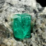 Beryl (variety emerald), Calcite<br />La Pita mining district, Cunas Mine, Municipio Maripí, Western Emerald Belt, Boyacá Department, Colombia<br />27x33x35mm, xl=9mm<br /> (Author: Fiebre Verde)