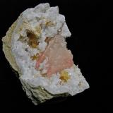 Dolomite and Calcite (variety manganese rich) on Quartz<br />State Route 37 road cuts, Harrodsburg, Clear Creek Township, Monroe County, Indiana, USA<br />quartz geode is 7 cm. the calcite is 5 cm<br /> (Author: Bob Harman)