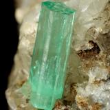 Beryl (variety emerald), Calcite<br />La Pita mining district, Polveros Mine, Municipio Maripí, Western Emerald Belt, Boyacá Department, Colombia<br />67x75x65mm, main xl=14mm<br /> (Author: Fiebre Verde)