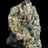 Beryl (variety emerald), Calcite, Dolomite, Pyrite<br />La Pita mining district, Polveros Mine, Municipio Maripí, Western Emerald Belt, Boyacá Department, Colombia<br />58x78x96mm, xl=9mm<br /> (Author: Fiebre Verde)