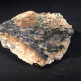 Columbite, Uraninite, Feldspar<br />Ray Mica Mine, Hurricane Mountain, Burnsville, Spruce Pine District, Yancey County, North Carolina, USA<br />77 mm x 70 mm x 55 mm<br /> (Author: Robert Seitz)