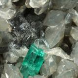 Beryl (variety emerald), Calcite, Dolomite<br />La Pita mining district, Municipio Maripí, Western Emerald Belt, Boyacá Department, Colombia<br />81x58x36mm, xls up to 6mm<br /> (Author: Fiebre Verde)