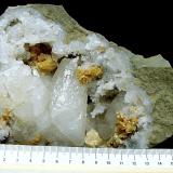 Calcite and Dolomite on QuartzState Route 37 road cuts, Harrodsburg, Clear Creek Township, Monroe County, Indiana, USAgeode is 13 cm, the calcite is 4.2 cm and the dolomite groups are up to 2.6 cm (Author: Bob Harman)