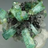 Beryl (variety emerald), Calcite<br />La Pita mining district, Polveros Mine, Municipio Maripí, Western Emerald Belt, Boyacá Department, Colombia<br />35x35mm<br /> (Author: Fiebre Verde)