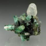 Beryl (variety emerald), Calcite<br />La Pita mining district, Polveros Mine, Municipio Maripí, Western Emerald Belt, Boyacá Department, Colombia<br />35x35mm<br /> (Author: Fiebre Verde)