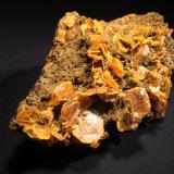 Wulfenite, Endlichite<br />Erupción Mine (Ahumada Mine), Los Lamentos Mountain Range, Municipio Ahumada, Chihuahua, Mexico<br />155 mm x 110 mm x 65 mm<br /> (Author: Robert Seitz)