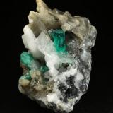 Beryl (variety emerald), Calcite, Pyrite<br />Muzo mining district, Western Emerald Belt, Boyacá Department, Colombia<br />27x37x35mm, main xl=7mm<br /> (Author: Fiebre Verde)