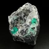 Beryl (variety emerald), Calcite, Dolomite<br />La Pita mining district, Cunas Mine, Municipio Maripí, Western Emerald Belt, Boyacá Department, Colombia<br />56x44x51mm, xls=7mm & 4mm<br /> (Author: Fiebre Verde)