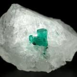 Beryl (variety emerald), Calcite<br />Peñas Blancas Mine, Municipio San Pablo de Borbur, Western Emerald Belt, Boyacá Department, Colombia<br />27x18x18mm - Aggregate=6x5mm<br /> (Author: Fiebre Verde)