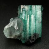 Beryl (variety emerald), Calcite<br />Muzo mining district, Western Emerald Belt, Boyacá Department, Colombia<br />xl=19x13mm<br /> (Author: Fiebre Verde)