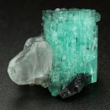 Beryl (variety emerald), Calcite<br />Muzo mining district, Western Emerald Belt, Boyacá Department, Colombia<br />xl=19x13mm<br /> (Author: Fiebre Verde)