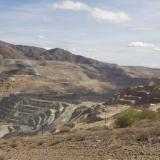 _At the far left bottom, you can just make out a 400 ton, Lieberr T282B haul truck, the size of a two story house, moving it’s load at a walking speed toward the primary crusher. (Author: vic rzonca)