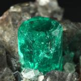 Beryl (variety emerald), Calcite, Dolomite<br />La Pita mining district, Municipio Maripí, Western Emerald Belt, Boyacá Department, Colombia<br />37x24x31mm, xl=24mm<br /> (Author: Fiebre Verde)