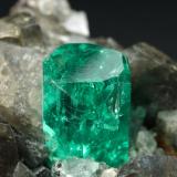 Beryl (variety emerald), Calcite, Dolomite<br />La Pita mining district, Municipio Maripí, Western Emerald Belt, Boyacá Department, Colombia<br />37x24x31mm, xl=24mm<br /> (Author: Fiebre Verde)