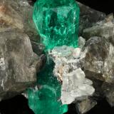 Beryl (variety emerald), Calcite, Dolomite<br />La Pita mining district, Municipio Maripí, Western Emerald Belt, Boyacá Department, Colombia<br />37x24x31mm, xl=24mm<br /> (Author: Fiebre Verde)