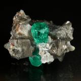 Beryl (variety emerald), Calcite, Dolomite<br />La Pita mining district, Municipio Maripí, Western Emerald Belt, Boyacá Department, Colombia<br />37x24x31mm, xl=24mm<br /> (Author: Fiebre Verde)