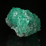 Beryl (variety emerald), Calcite<br />Coscuez mining district, Municipio San Pablo de Borbur, Western Emerald Belt, Boyacá Department, Colombia<br />24mm across<br /> (Author: Fiebre Verde)