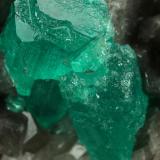 Beryl (variety emerald), Calcite, Dolomite<br />Muzo mining district, Western Emerald Belt, Boyacá Department, Colombia<br />79x49x66mm, largest xl=13x9mm<br /> (Author: Fiebre Verde)
